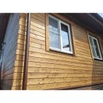 Облицовка фасада домов планкеном из древесины сибирской лиственницы 2000х90х20мм. с покрытием восковой лазурью цвет ‘орех’
